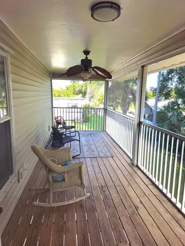 a view of two chairs in the balcony