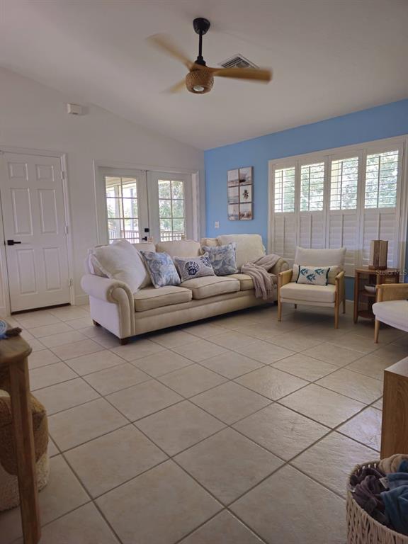 4472 Mariner Road Bonita Springs, FL 34134 - Photo 33 of 36 a living room with furniture and a window