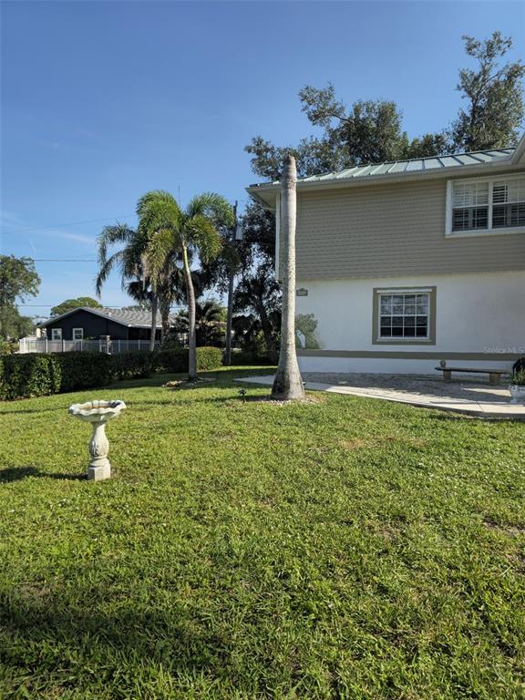 4472 Mariner Road Bonita Springs, FL 34134 - Photo 4 of 36 a front view of a house with garden
