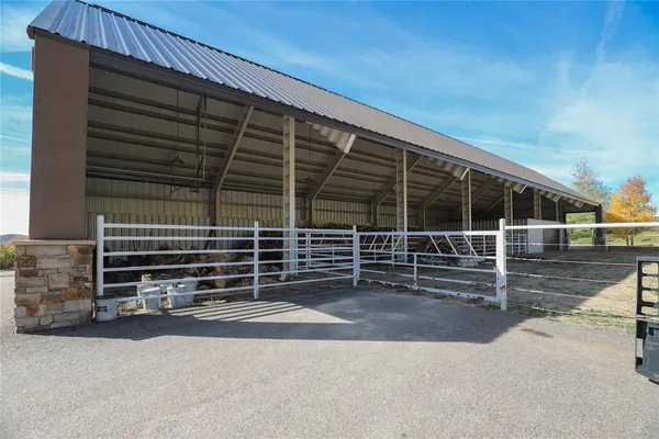 a view of a car park in front of a house