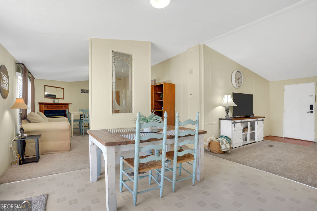 1775 Stoopto Road Sylvania, GA 30467 - Photo 14 of 66 a living room with furniture and a flat screen tv