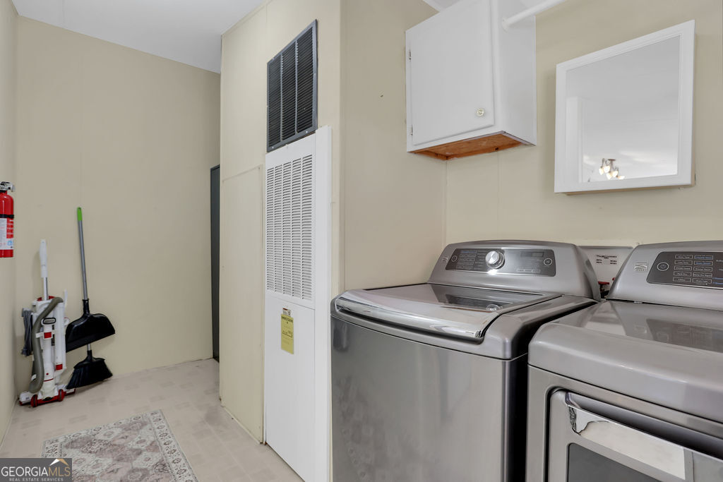 1775 Stoopto Road Sylvania, GA 30467 - Photo 18 of 66 a view of storage and utility room with two washing machine