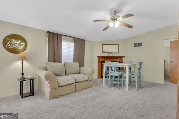 a bedroom with a large bed and a flat screen tv