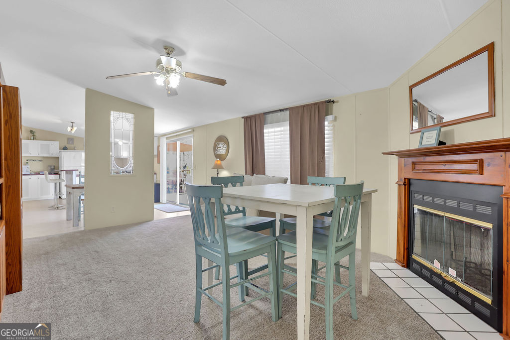 1775 Stoopto Road Sylvania, GA 30467 - Photo 21 of 66 a view of a dining room with furniture and chandelier