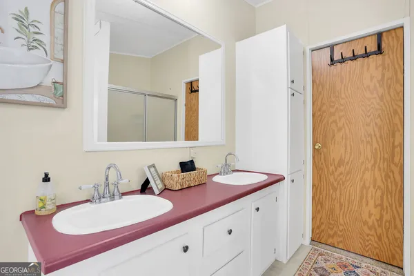 a bed sitting in a room next to a window