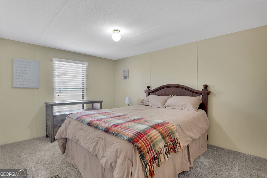 1775 Stoopto Road Sylvania, GA 30467 - Photo 33 of 66 a bedroom with a bed and a window