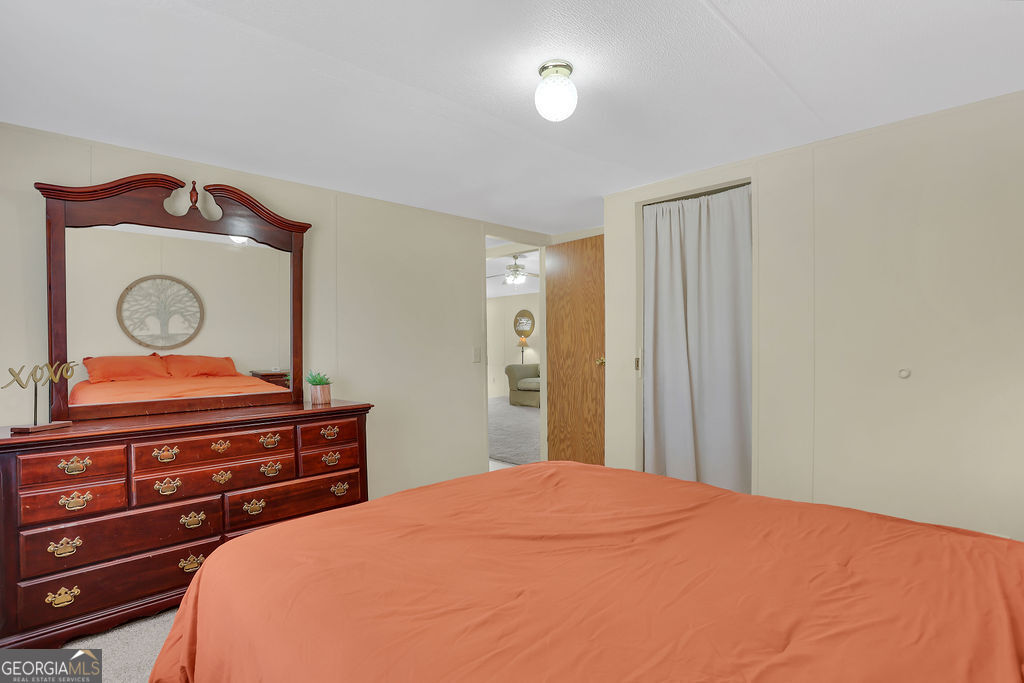 1775 Stoopto Road Sylvania, GA 30467 - Photo 38 of 66 a bedroom with a bed and a dresser