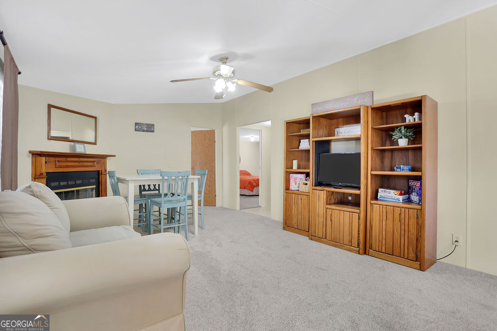 1775 Stoopto Road Sylvania, GA 30467 - Photo 4 of 66 a living room with furniture and a fireplace