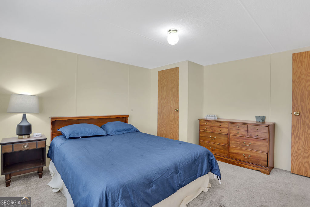 1775 Stoopto Road Sylvania, GA 30467 - Photo 43 of 66 a bedroom with a bed and dresser
