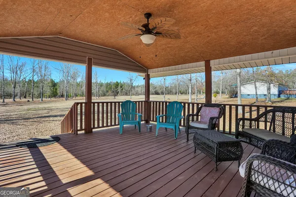 a balcony with wooden floor and outdoor space