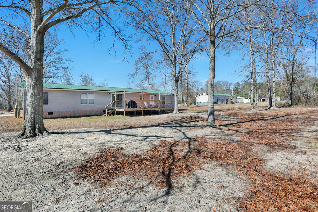 1775 Stoopto Road Sylvania, GA 30467 - Photo 55 of 66 a view of a backyard of a house