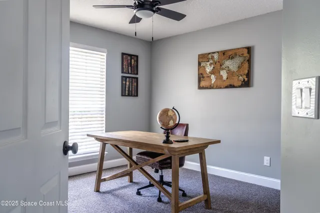 a workspace with furniture and window