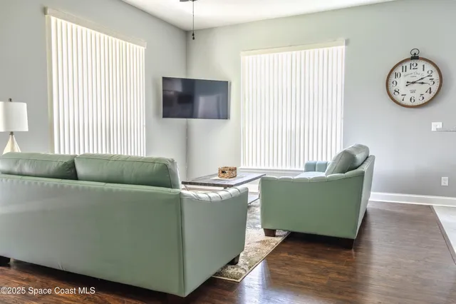 a living room with furniture and a window