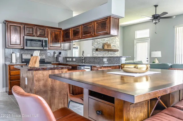 a kitchen with a stove a sink and a microwave