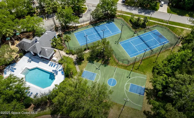 an aerial view of residential house with outdoor space and parking