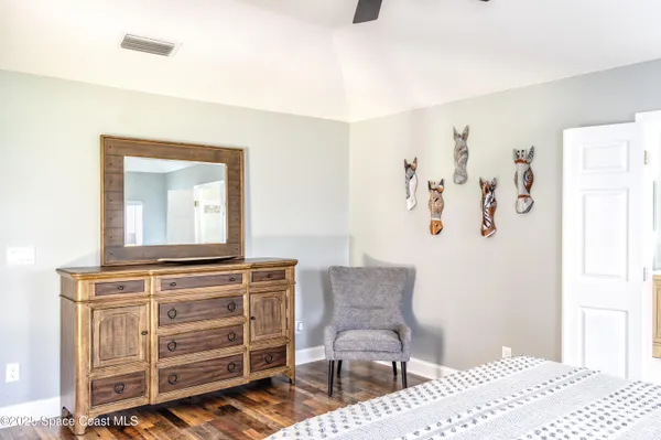 a view of a bedroom with furniture and cabinet