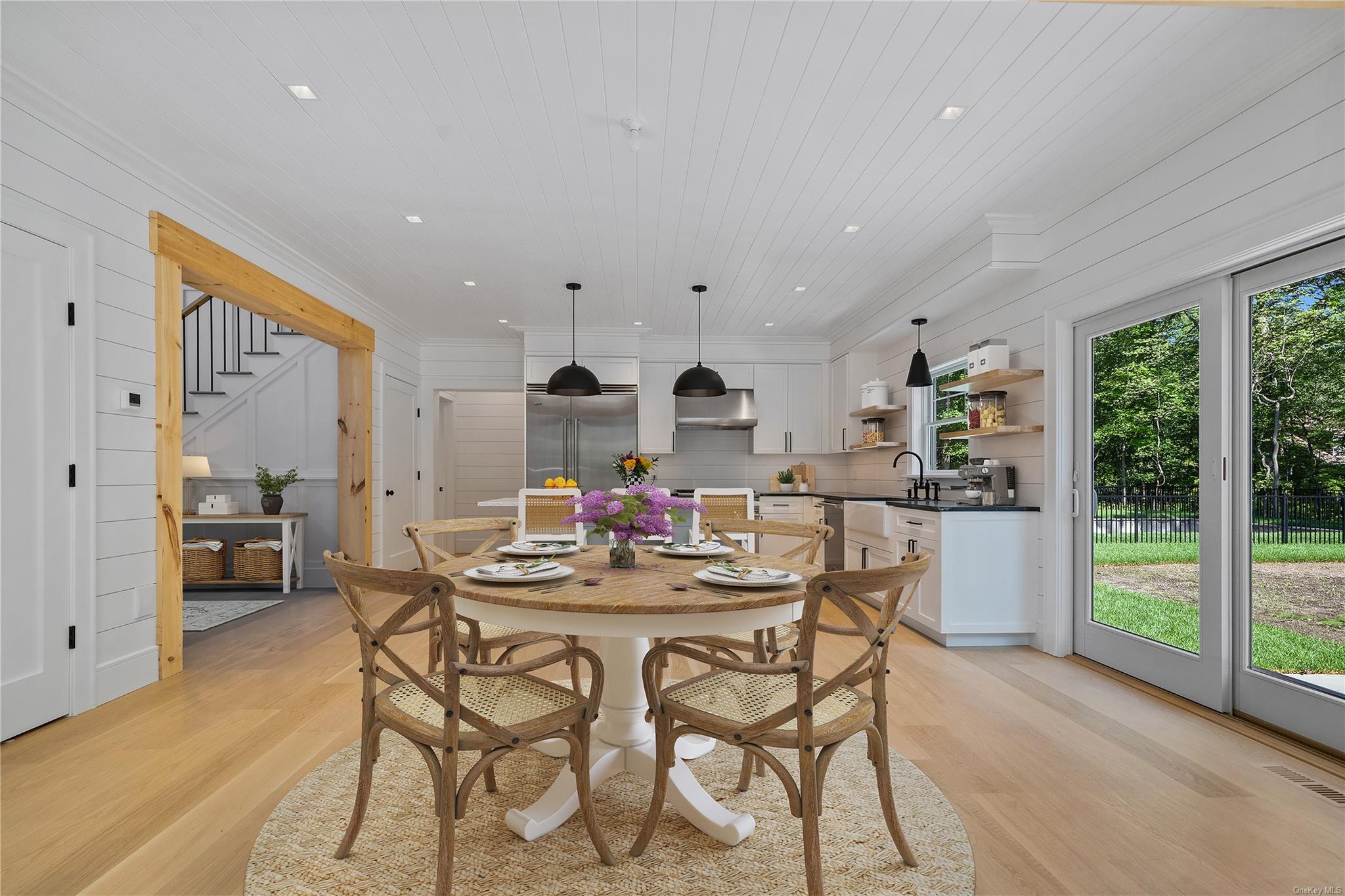 293 Beaver Dam Road Brookhaven, NY 11719 - Photo 8 of 33 Dining space with sink, wood ceiling, light hardwood / wood-style flooring, and ornamental molding