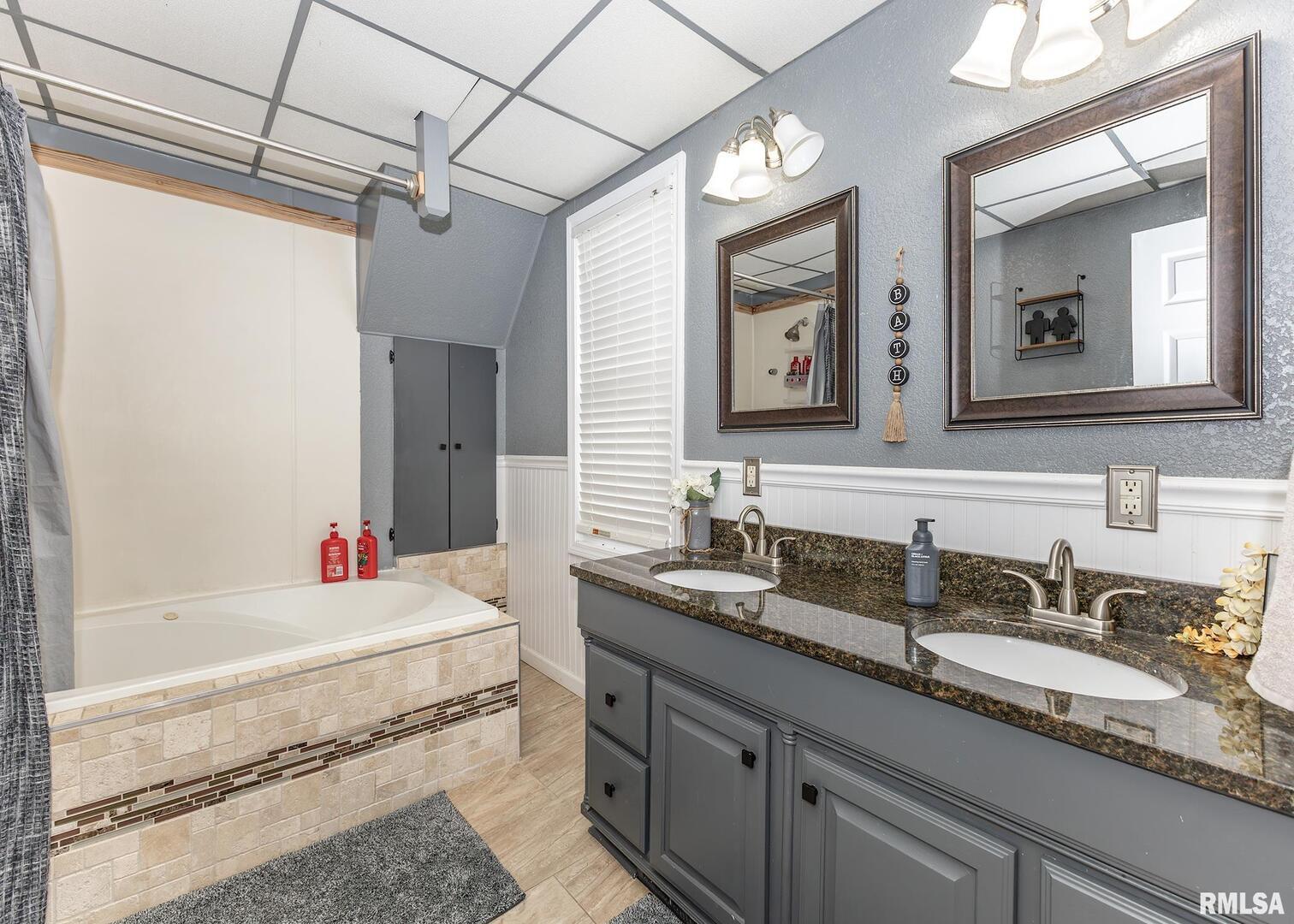 11696 Co Highway 19 Cambridge, IL 61238 - Photo 25 of 33 a bathroom with a sink double vanity granite and a mirror