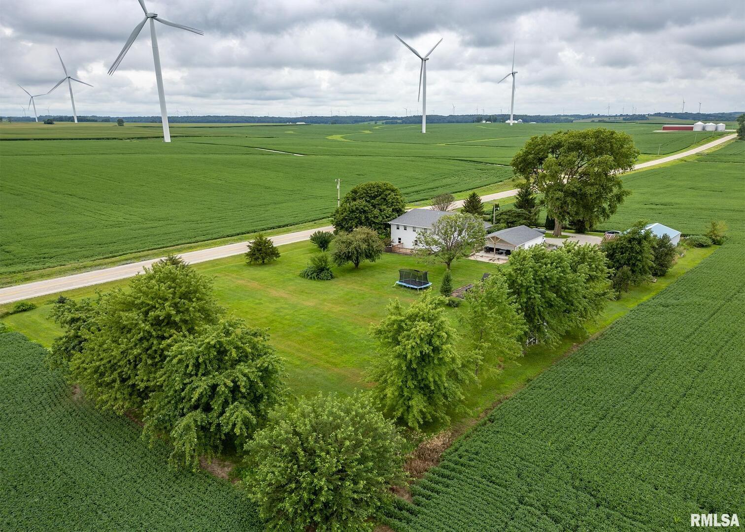 11696 Co Highway 19 Cambridge, IL 61238 - Photo 4 of 33 a view of a golf course with a lake