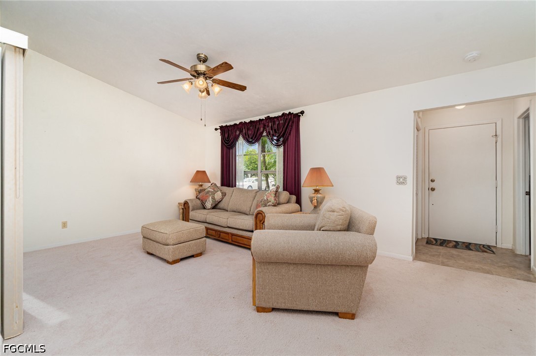 10615 Roxbury Court Lehigh Acres, FL 33936 - Photo 4 of 33 a living room with furniture