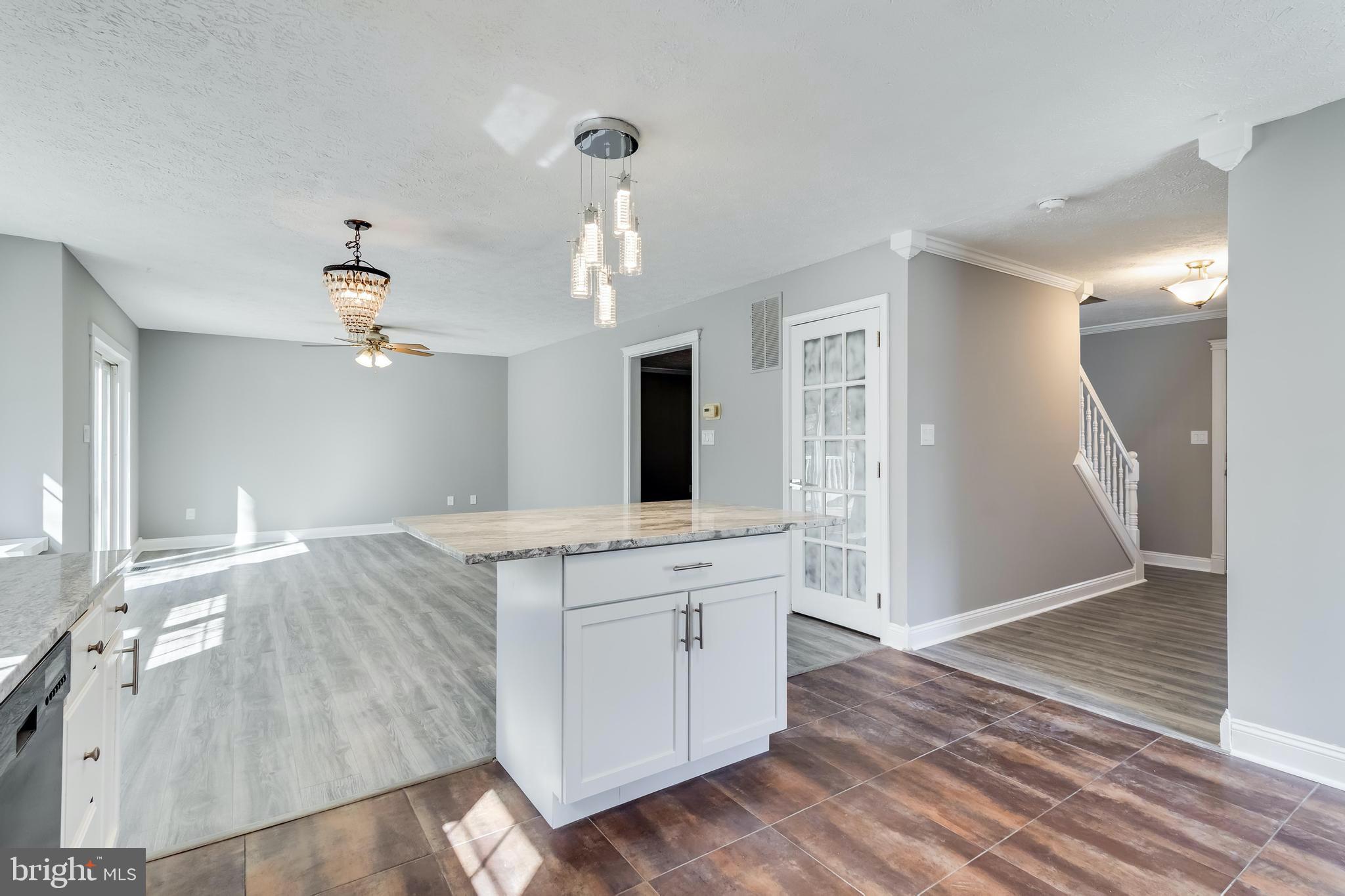 648 Santa Fe Trail Lusby, MD 20657 - Photo 19 of 58 a view of a kitchen cabinets and wooden floor