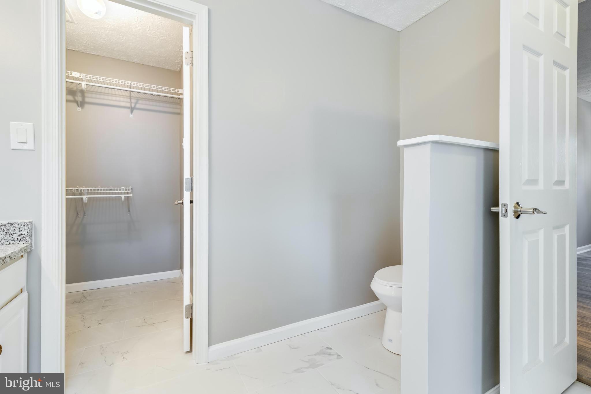 648 Santa Fe Trail Lusby, MD 20657 - Photo 27 of 58 a bathroom with a granite countertop shower