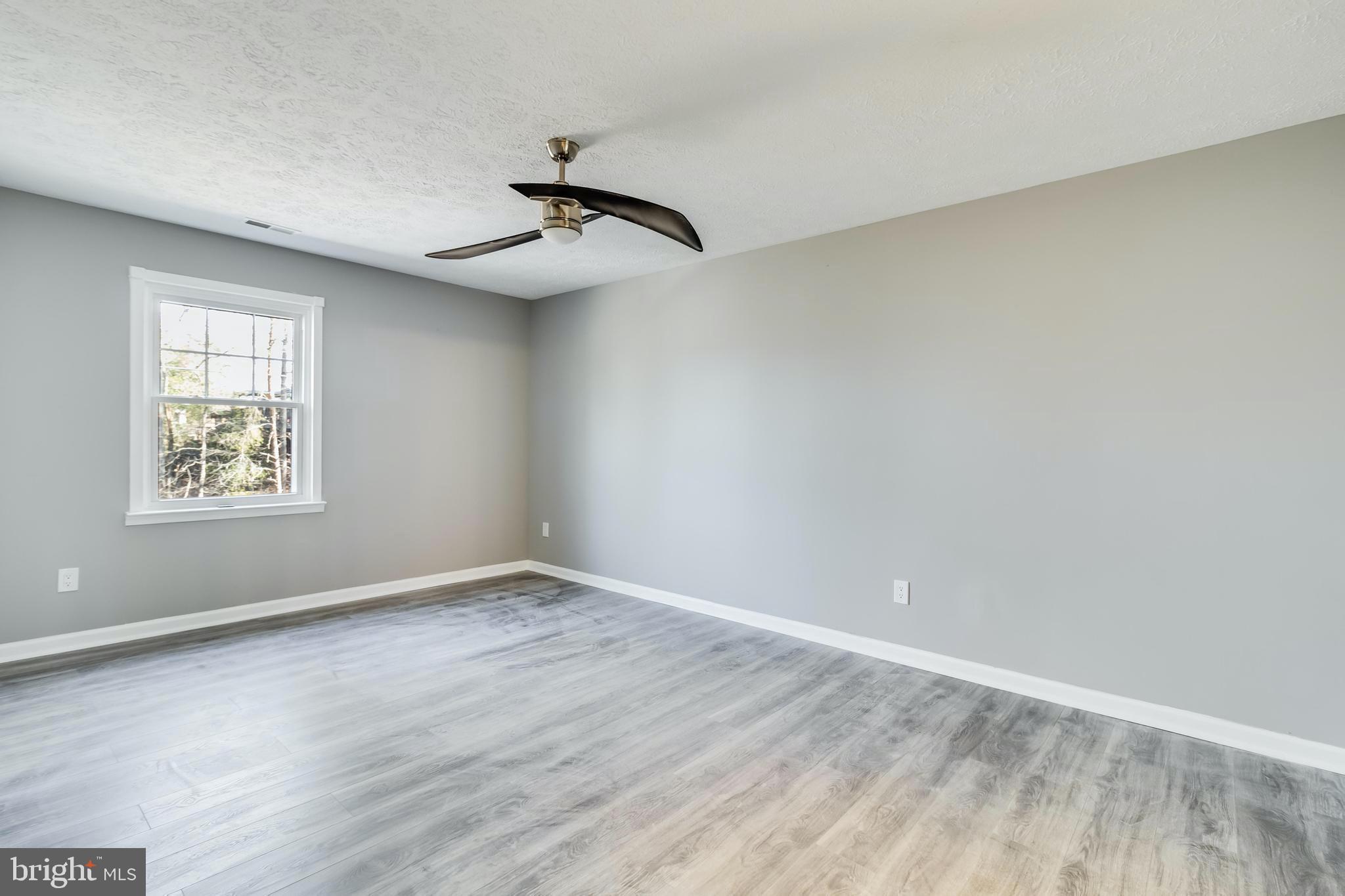 648 Santa Fe Trail Lusby, MD 20657 - Photo 30 of 58 wooden floor in an empty room with a window