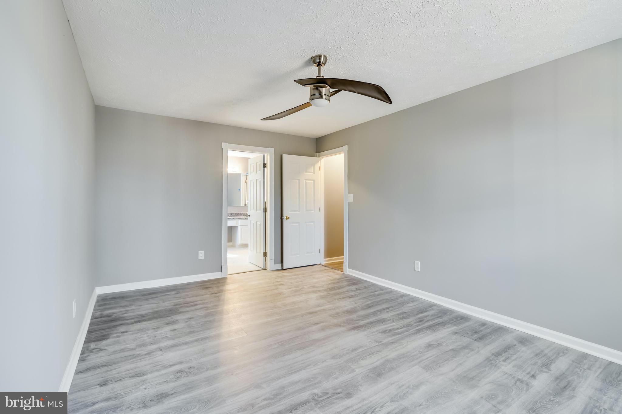 648 Santa Fe Trail Lusby, MD 20657 - Photo 31 of 58 a view of room with a ceiling fan and window