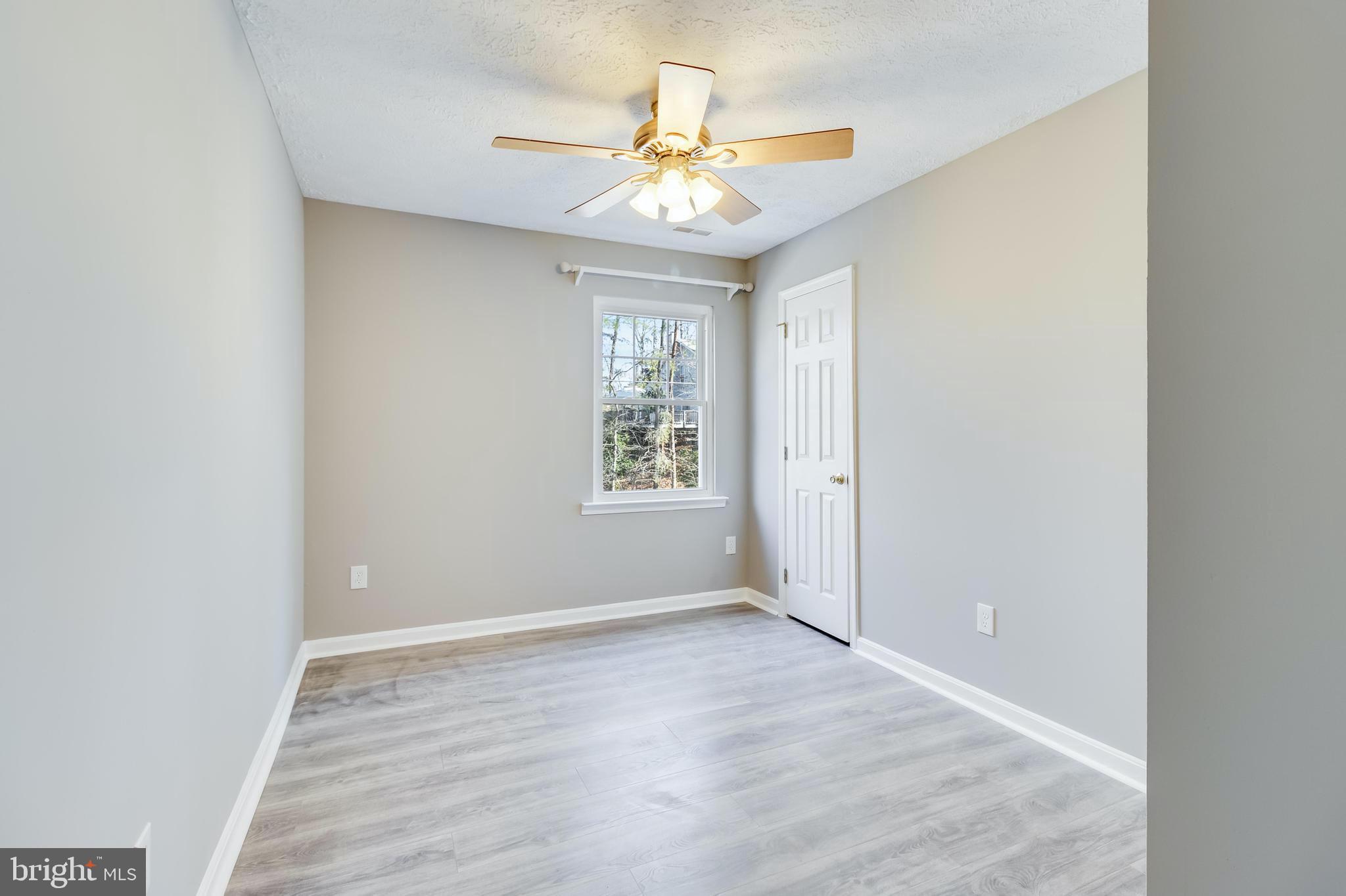 648 Santa Fe Trail Lusby, MD 20657 - Photo 35 of 58 wooden floor in an empty room with a window