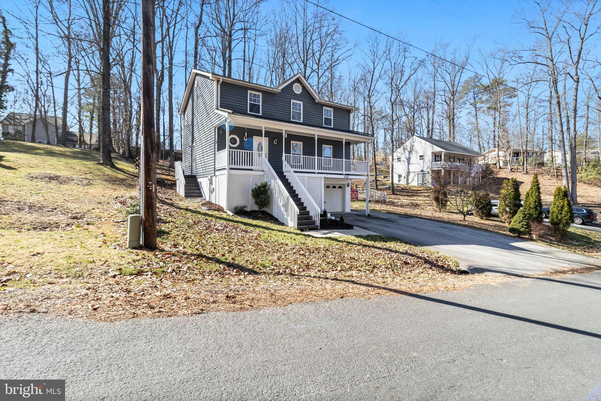 648 Santa Fe Trail Lusby, MD 20657 - Photo 4 of 58 a view of a house with snow on the side of the road