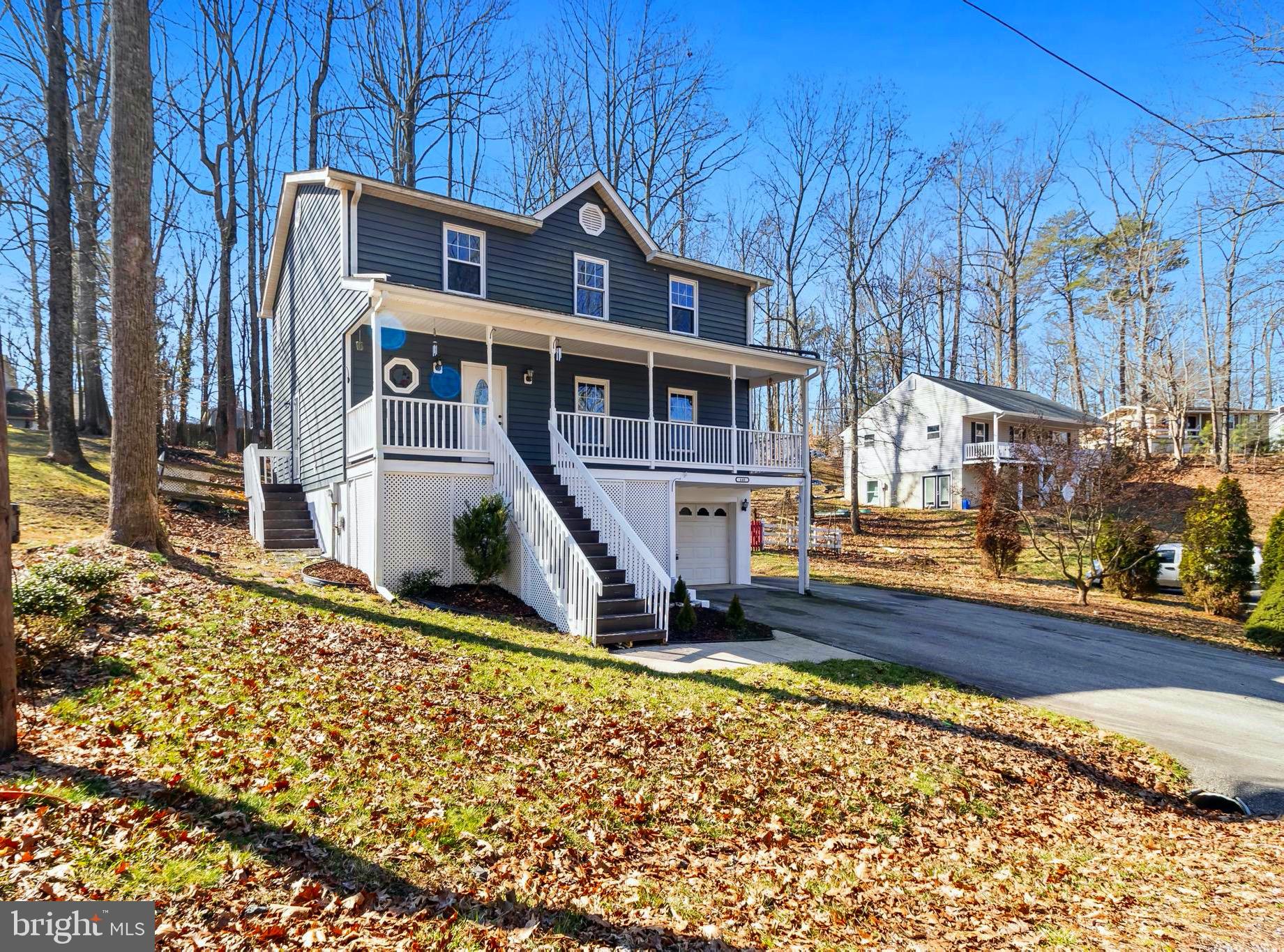 648 Santa Fe Trail Lusby, MD 20657 - Photo 42 of 58 a front view of a house with a yard