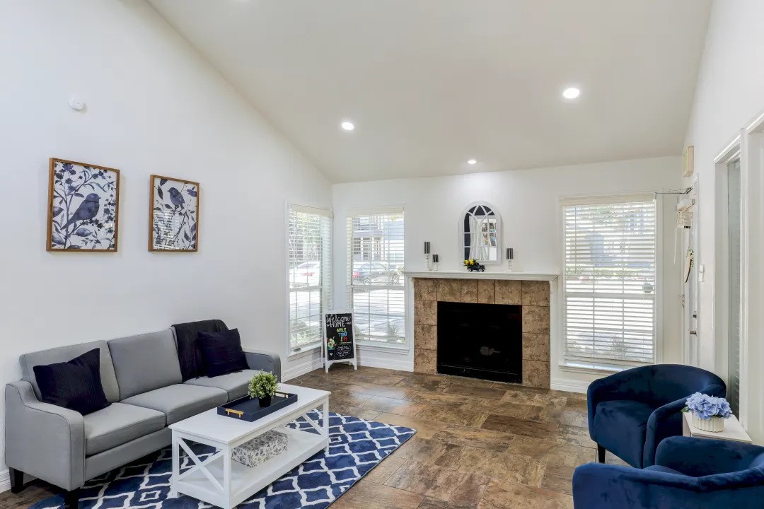 1100 Graham Drive, Unit 1714 Tomball, TX 77375 - Photo 15 of 27 a living room with furniture and a fireplace