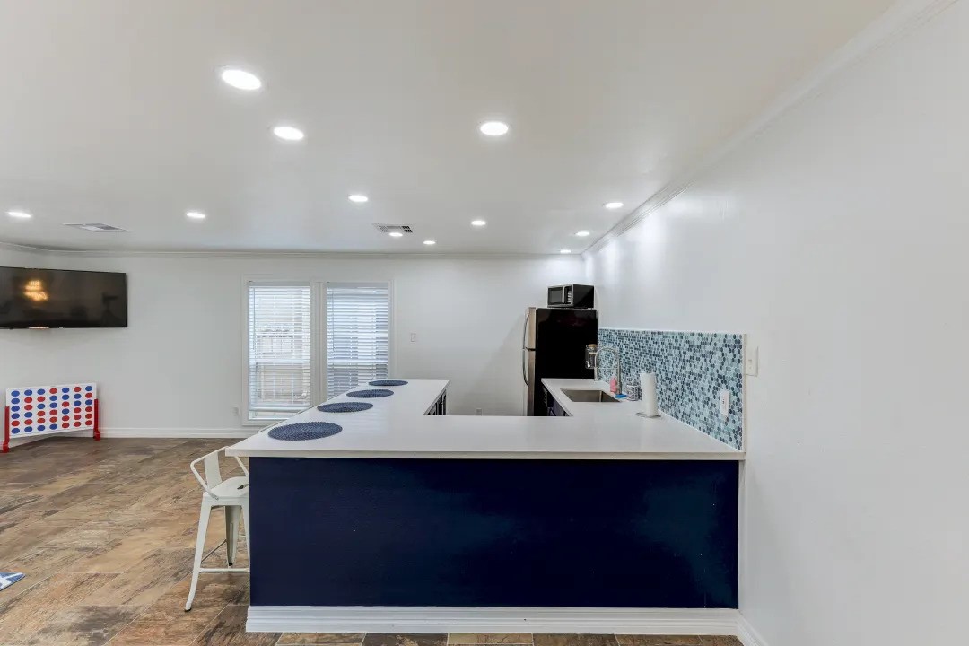 1100 Graham Drive, Unit 1714 Tomball, TX 77375 - Photo 17 of 27 a bathroom with a sink and a mirror