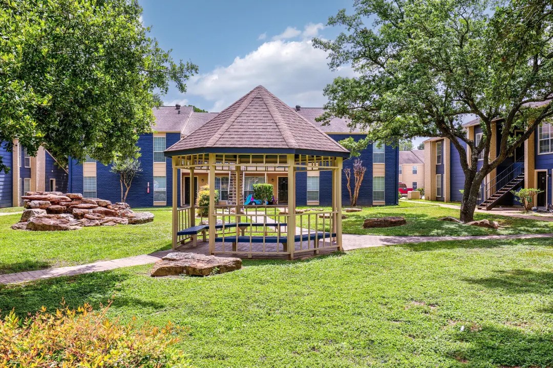 1100 Graham Drive, Unit 1714 Tomball, TX 77375 - Photo 21 of 27 a view of a house with a yard porch and sitting area