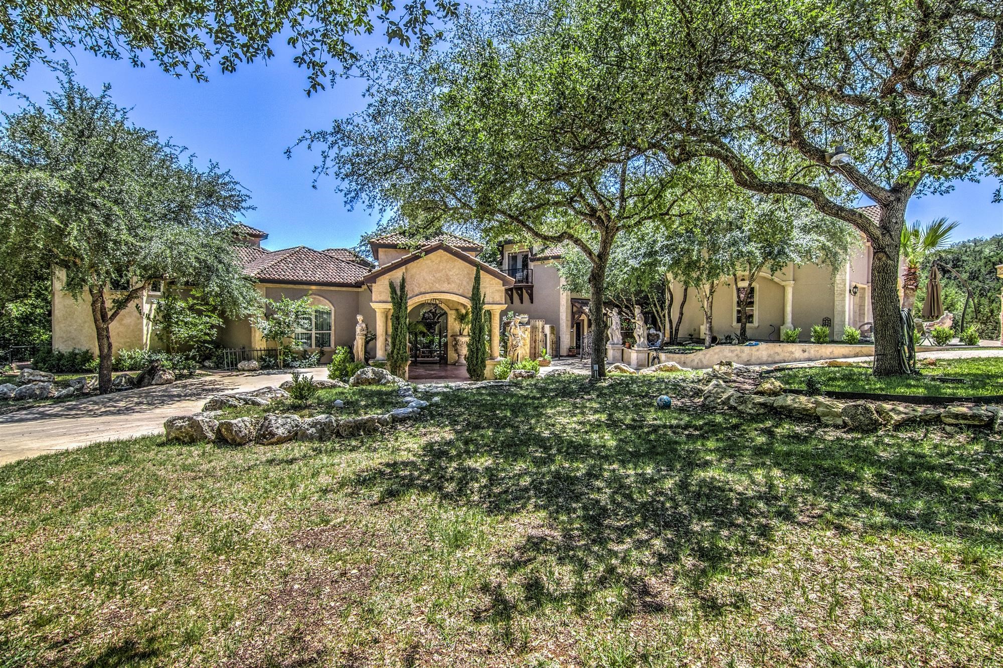 a front view of a house with a yard garage and outdoor seating