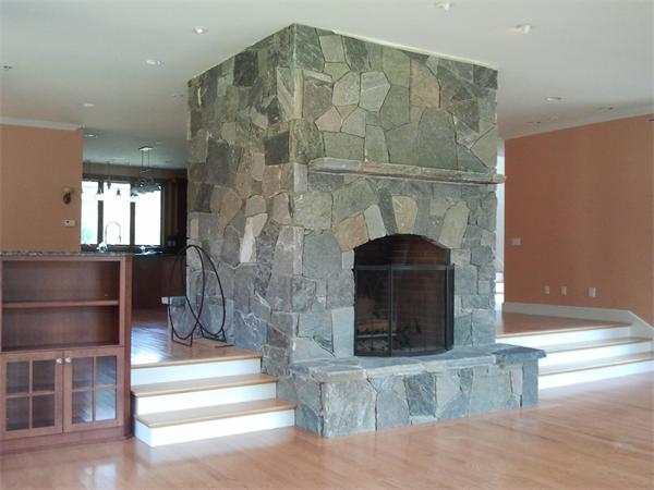 8 Burgess Point Road Wareham, MA 02571 - Photo 14 of 24 a living room with a fireplace and a rug
