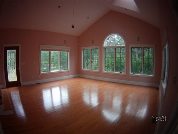 8 Burgess Point Road Wareham, MA 02571 - Photo 6 of 24 a view of an empty room with wooden floor and a window