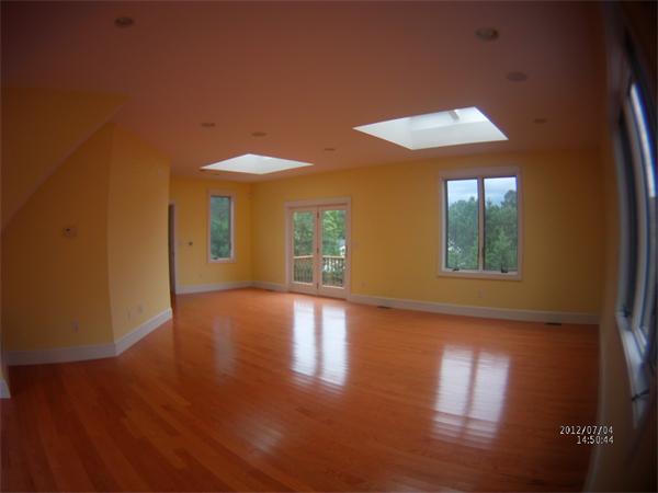 8 Burgess Point Road Wareham, MA 02571 - Photo 8 of 24 a view of an empty room with wooden floor and a window