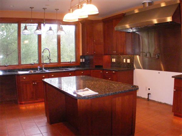 8 Burgess Point Road Wareham, MA 02571 - Photo 10 of 24 a kitchen with stainless steel appliances granite countertop a sink a counter space and a view of living room