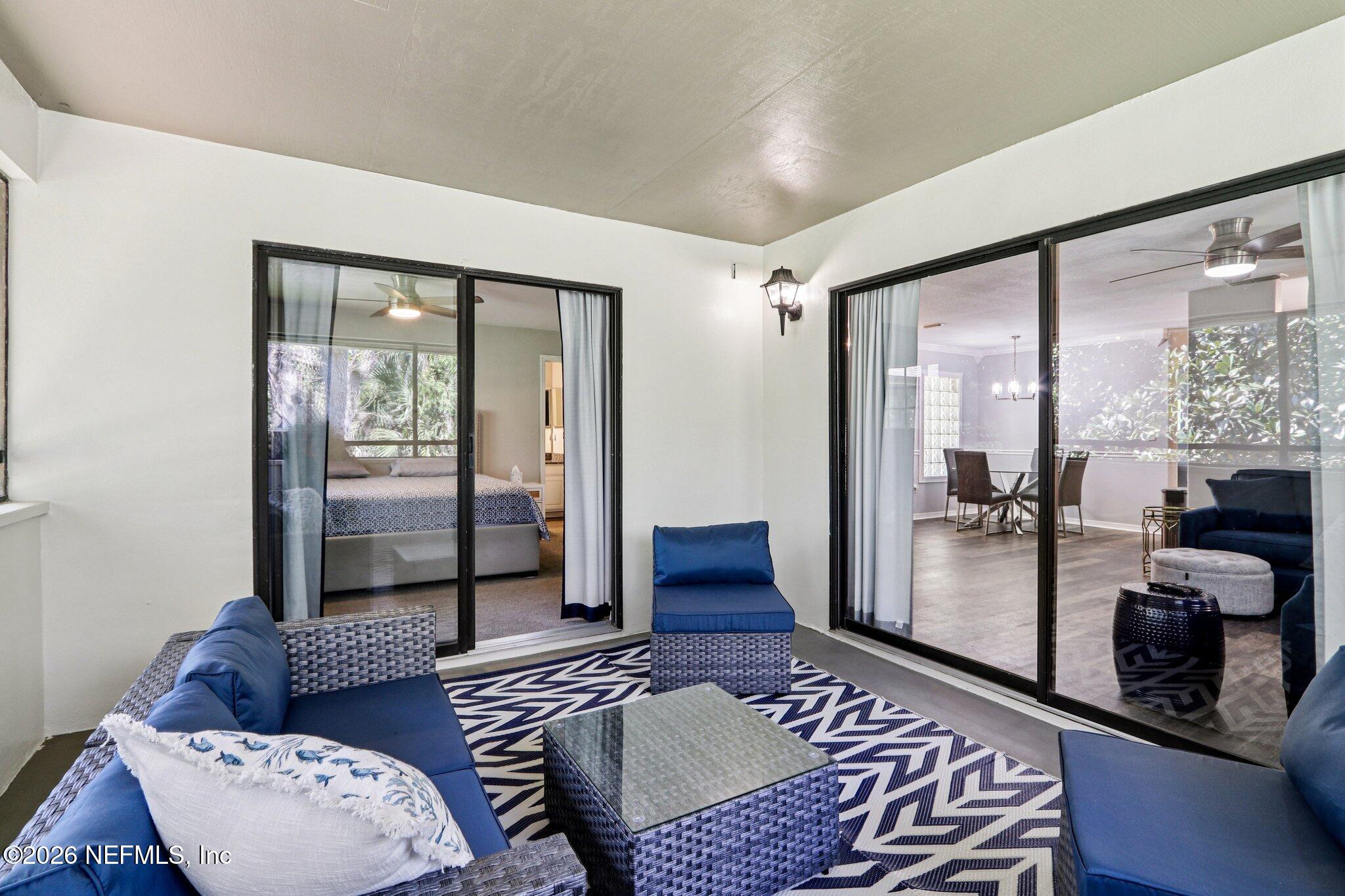 10150 Belle Rive Boulevard, Unit 102 Jacksonville, FL 32256 - Photo 19 of 33 a living room with furniture and a large window