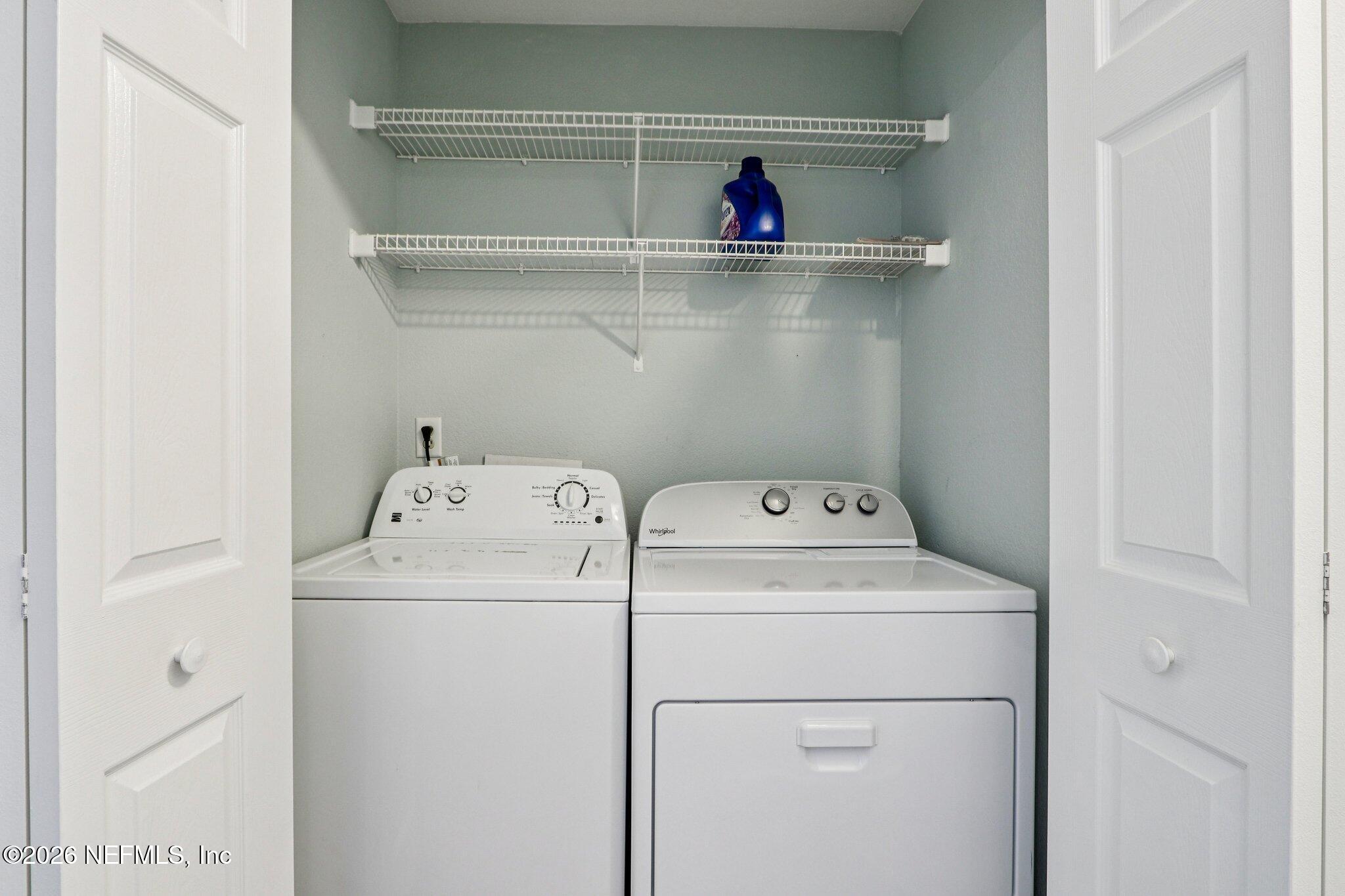 10150 Belle Rive Boulevard, Unit 102 Jacksonville, FL 32256 - Photo 21 of 33 a utility room with dryer and washer