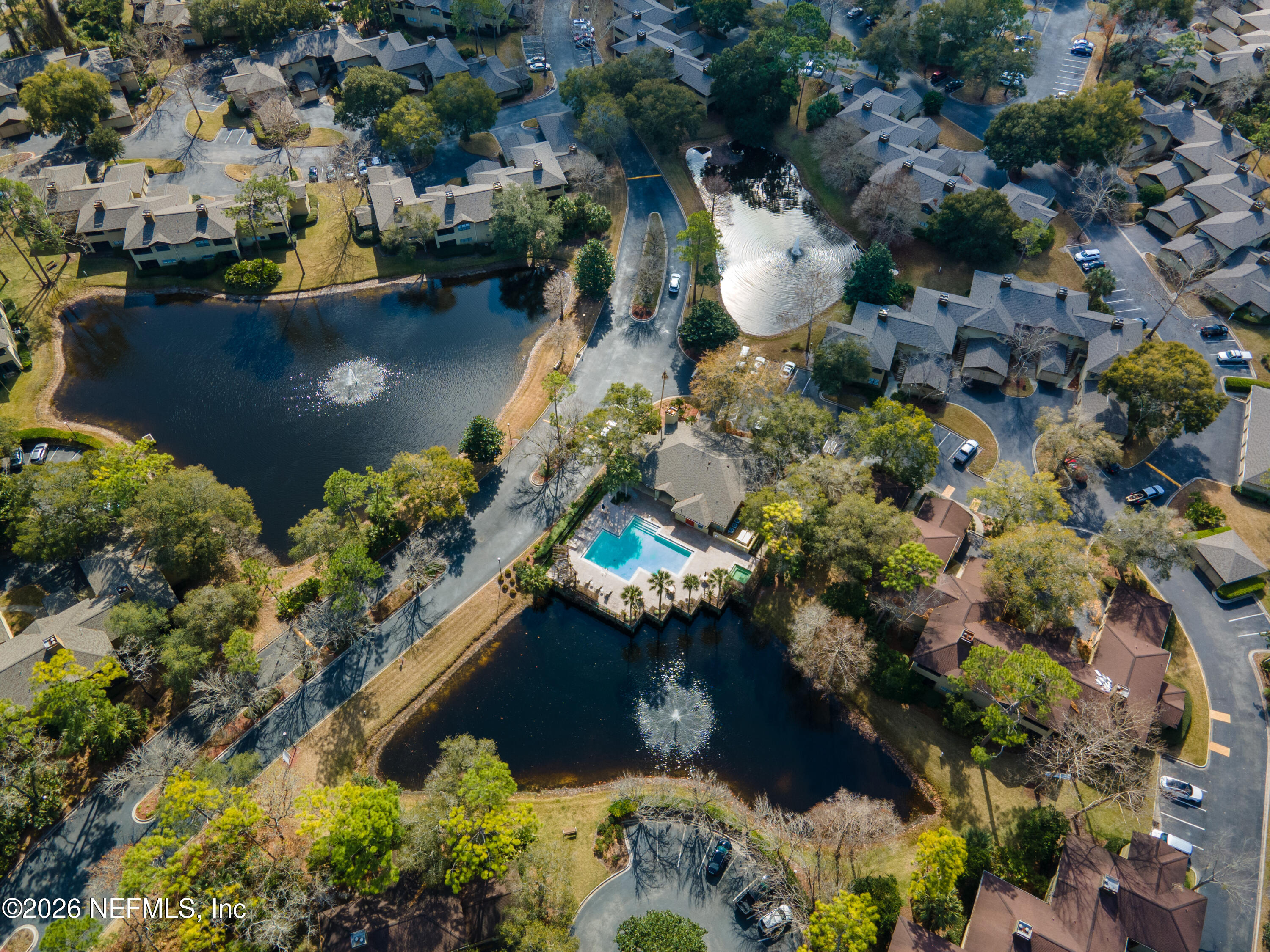 10150 Belle Rive Boulevard, Unit 102 Jacksonville, FL 32256 - Photo 30 of 33 a view of a lake with a house