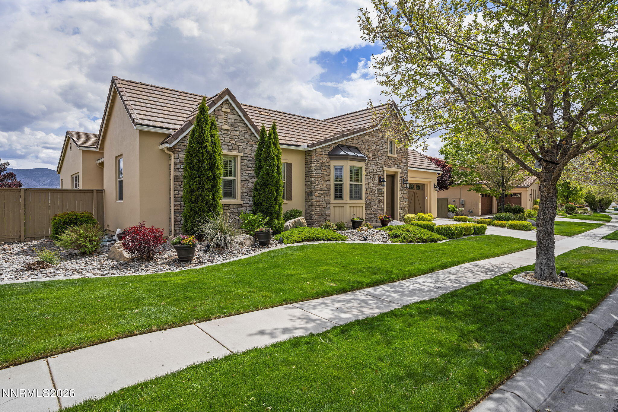 13340 Damonte View Lane Reno, NV 89511 - Photo 1 of 44 a front view of a house with a garden and plants