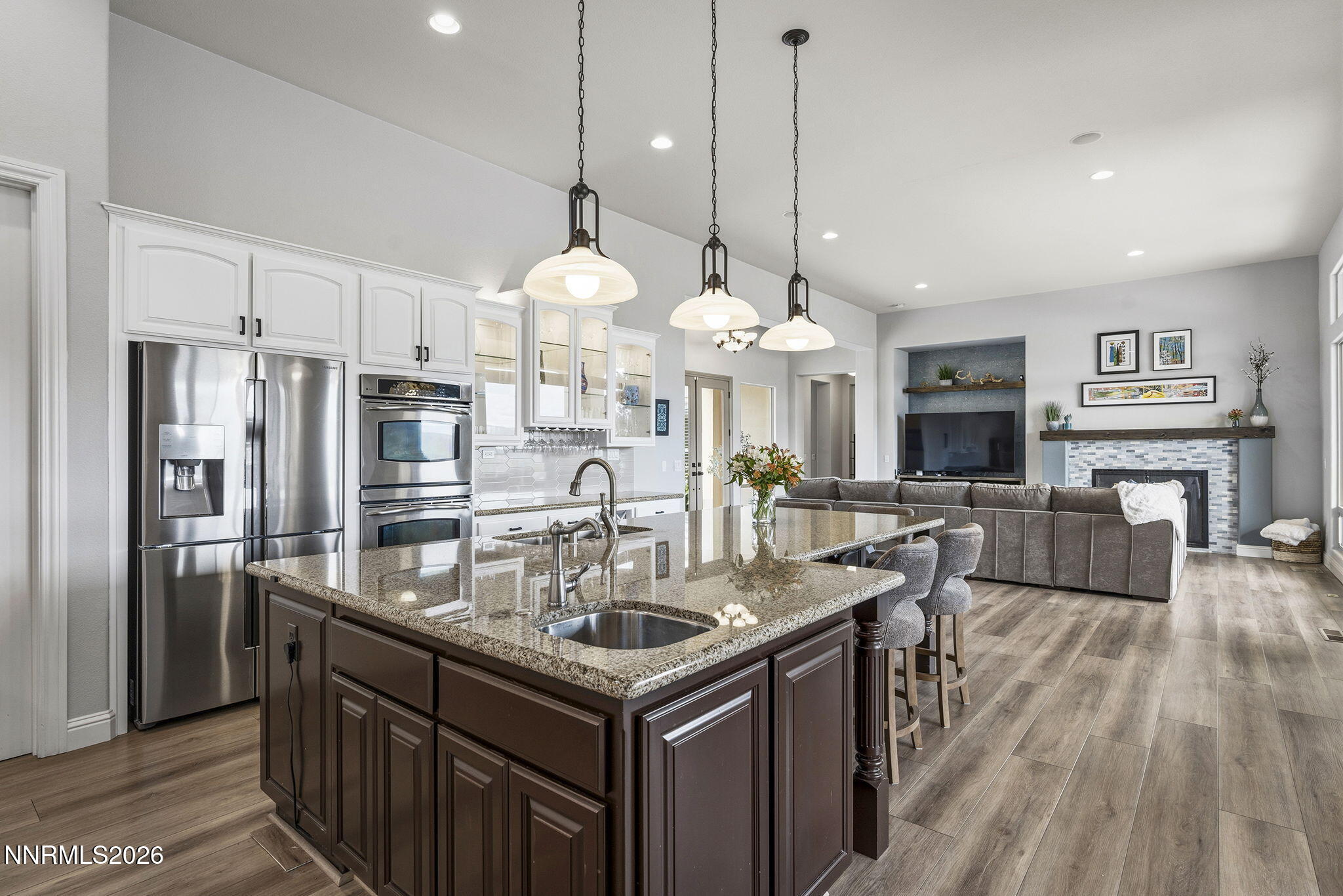 13340 Damonte View Lane Reno, NV 89511 - Photo 15 of 44 a kitchen with stainless steel appliances granite countertop a sink a stove and a refrigerator