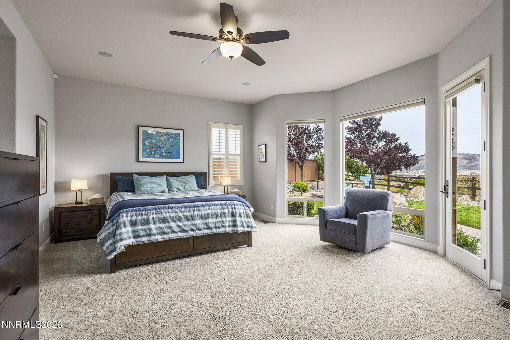 13340 Damonte View Lane Reno, NV 89511 - Photo 18 of 44 a bedroom with a large bed couch and a window