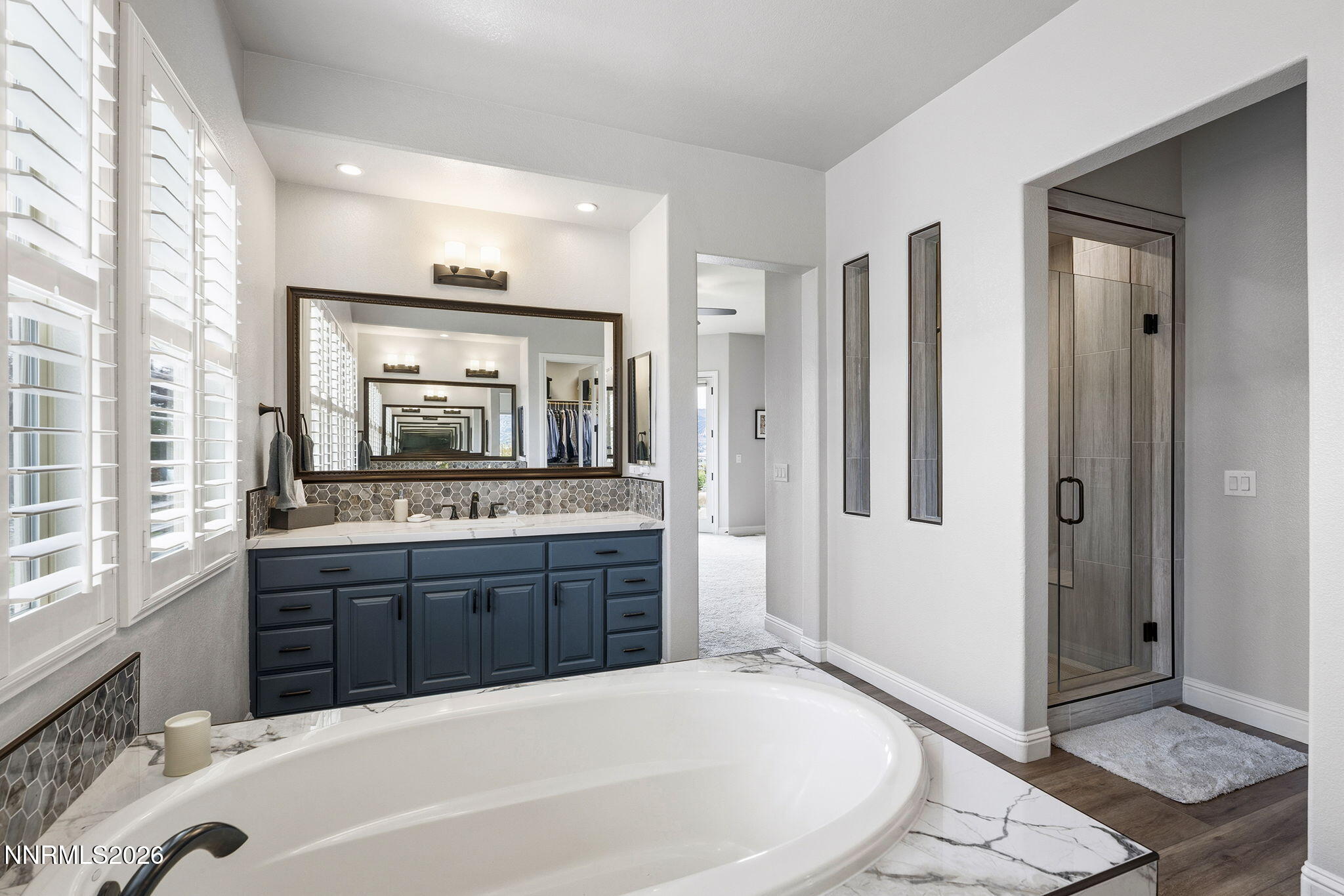 13340 Damonte View Lane Reno, NV 89511 - Photo 22 of 44 a spacious bathroom with a tub sink and mirror