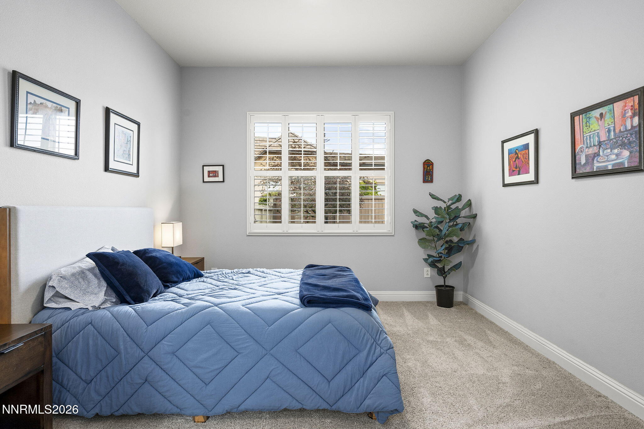13340 Damonte View Lane Reno, NV 89511 - Photo 24 of 44 a bedroom with a bed and a potted plant