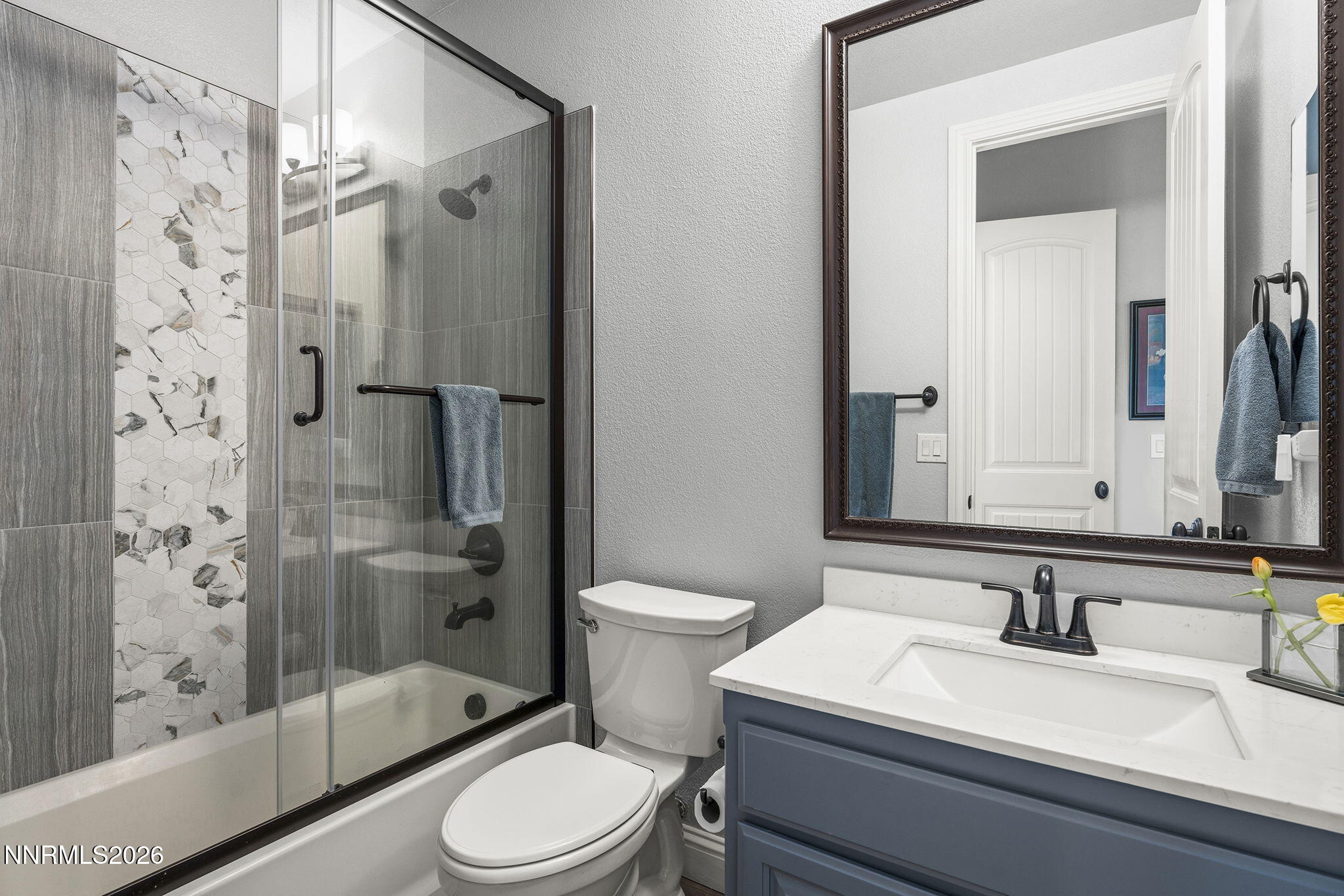 13340 Damonte View Lane Reno, NV 89511 - Photo 26 of 44 a bathroom with a sink a toilet and shower
