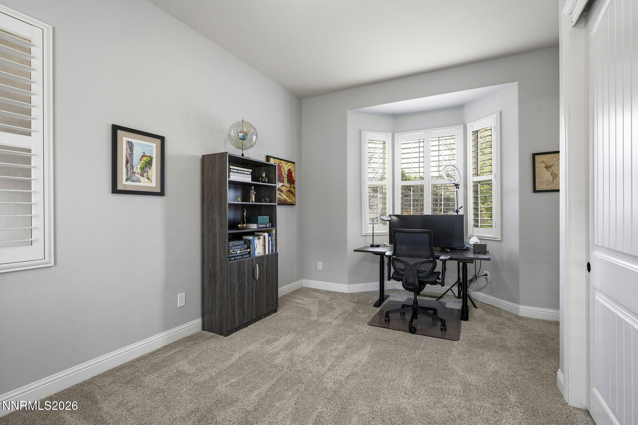 13340 Damonte View Lane Reno, NV 89511 - Photo 27 of 44 a view of a workspace with furniture and a window