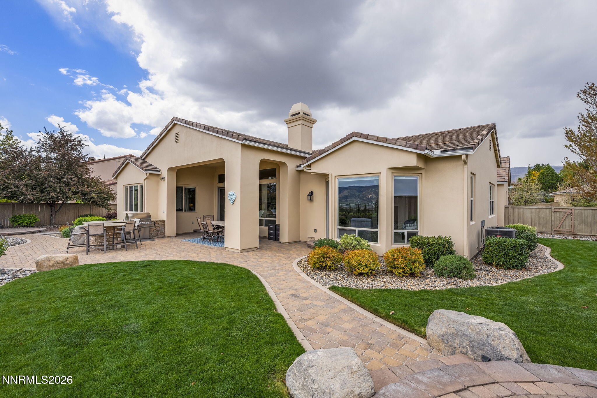 13340 Damonte View Lane Reno, NV 89511 - Photo 34 of 44 a front view of a house with porch and garden